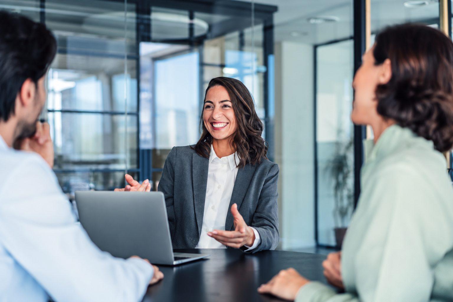 Recruitment consultant meeting client hiring managers in a Bangkok office